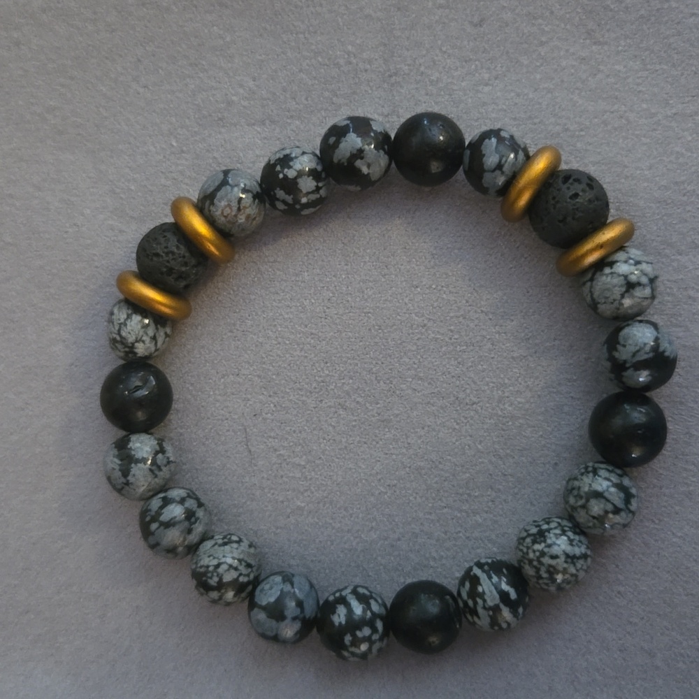 Stretchy black, gray, and copper bracelet.
